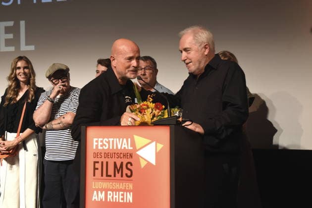 Christian Berkel Schauspieler Festivalpreistraeger fuer Schauspielkunst 2026 Dr. Michael Goetz Laudator Festivalintendant Ludwigshafen 30..08.2026 am Rheinufer 22.Festival des Deutschen Films 2026 Foto Ludwigshafen
