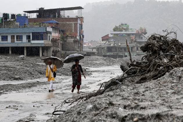 Aftermath of flash floods in Nepal Photo taken in Bidur, capital of Nepal s Nuwakot District, on Aug. 29, 2026, shows buildings submerged in mud after catastrophic flash floods along the Nepal-China border.  A14AA0005626801P