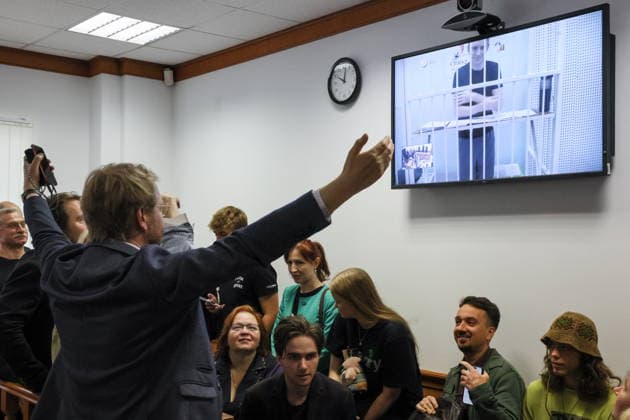 RUSSIA, MOSCOW - AUGUST 31, 2026: A former Moscow City Duma member of the Yabloko Party, Maxim Kruglov (placed on Russia’s list of terrorists and extremists), joins an appeal hearing at the Moscow City Court by videolink from a pretrial detention centre. Earlier, in June 2026, Moscow’s Zamoskvoretsky District Court found Kruglov guilty of spreading false information about the Russian Armed Forces and handed a seven year sentence in prison colony. Kruglov was also banned by the court from administering web sites for three years. Pictured at left is Yabloko Party Chairman Nikolai Rybakov.. Sergei Savostyanov TASS  96893608