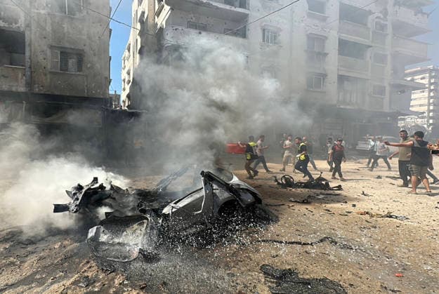 Palestinians Gather at Site of Israeli Strike in Gaza City Palestinians gather at the site of an Israeli strike that targeted a civilian vehicle in the Tal al-Hawa neighborhood of Gaza City on August 31, 2026, as firefighters try to extinguish a fire at the scene. Medics recovered the bodies of three Palestinians who were killed in the strike. Photo by Hadi Daoud apaimages Gaza city Gaza Strip Palestinian Territory 310826_Gaza_HD_00(5) Copyright: xapaimagesxHadixDaoudx xapaimagesx