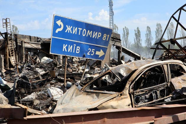 A burnt-out car stands beside a mileage sign showing distances to Zhytomyr and Kyiv in the village of Myla, Bucha district, Kyiv region, Ukraine, August 31, 2026. On August 28, Russian troops struck an ammunition storage facility, sparking a fire and detonations. So far, 38 people have been confirmed dead, and four remain missing. Most of the victims - 34 people - were residents and staff of Dobryi Dim, a private boarding house for the elderly. Law enforcement has opened criminal proceedings under articles relating to the crime of aggression and negligent military service. (Photo by Volodymyr Tarasov Ukrinform) Detonations in Kyiv region kill 38 people  Copyright: xTARASOVx