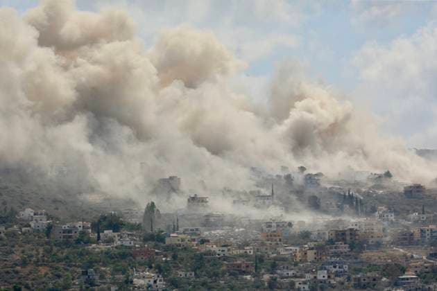 (260901) -- HANNIYEH, Sept. 1, 2026 -- The photo taken on Sept. 1, 2026 shows smoke billowing from houses hit during Israeli attacks in the town of Al-Mansouri in Hanniyeh, southern Lebanon. Israeli military operations continued across southern Lebanon on Sunday, with airstrikes, ground incursions, artillery bombardments, and demolition work, according to Lebanon s National News Agency (NNA). (Photo by Xinhua) LEBANON-HANNIYEH-ISRAELI ATTACKS-AFTERMATH AlixHashisho 