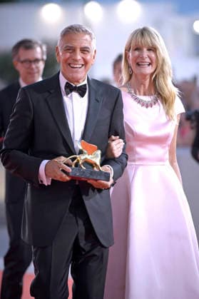 George Clooney poses on the red carpet with Laura Dern after receiving the Golden Lion for Lifetime Achievement Award during the Opening Ceremony the 83rd Venice International Film Festival at Sala Grande on September 2, 2026 in Venice, Italy.  VFF20260902870 RoccoxSpaziani