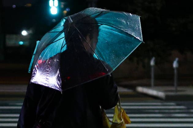 News Bilder des Tages JAPAN, TOKYO - SEPTEMBER 4, 2026: A man with an umbrella walks in a street Tokyo Japan  - ZUMAt113 20260904_zaa_t113_708 Copyright: xMikhailxTereshchenkox
