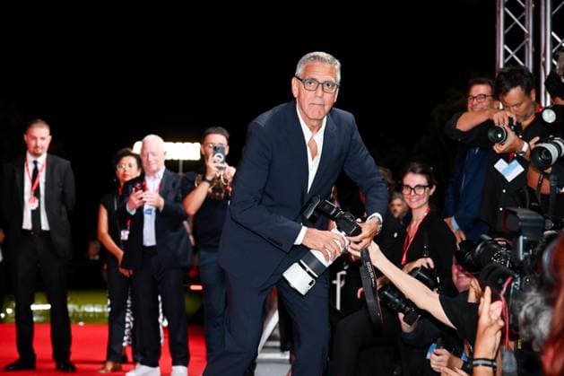 September 4, 2026, Venice, Rome, Italy: George Clooney takes a photographer s camera during the red carpet of the film Furies , 83rd Venice International Film Festival, Venice, 04 09 2026 Venice Italy  - ZUMAa289 20260904_zia_a289_453 Copyright: xMariaxLauraxAntonellix xAgfx