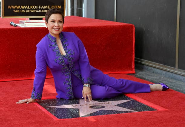 Filipina actress and singer Lea Salonga sits beside her star during an unveiling ceremony honoring her with the 2,855th star on the Hollywood Walk of Fame in Los Angeles on Friday, September 4, 2026.  LAP2026090402 JIMxRUYMEN