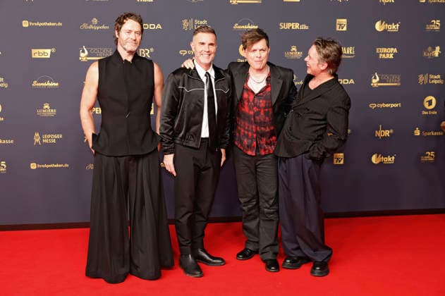 Howard Donald, Gary Barlow und Mark Owen von Take That und Michael Patrick Kelly bei der 32. Verleihung der Goldenen Henne 2026 in der Leipziger Messe. Leipzig, 04.09.2026