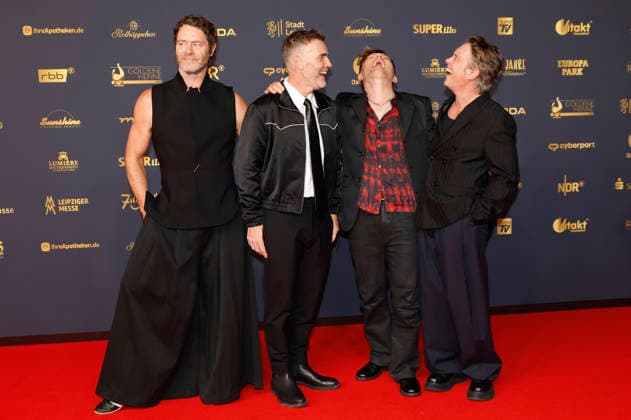 Howard Donald, Gary Barlow und Mark Owen von Take That und Michael Patrick Kelly bei der 32. Verleihung der Goldenen Henne 2026 in der Leipziger Messe. Leipzig, 04.09.2026