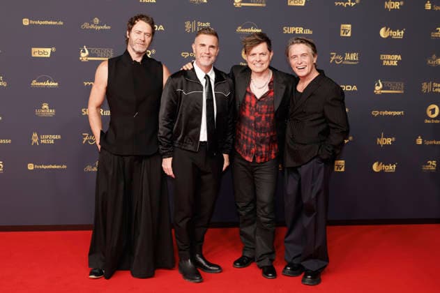 Howard Donald, Gary Barlow und Mark Owen von Take That und Michael Patrick Kelly bei der 32. Verleihung der Goldenen Henne 2026 in der Leipziger Messe. Leipzig, 04.09.2026