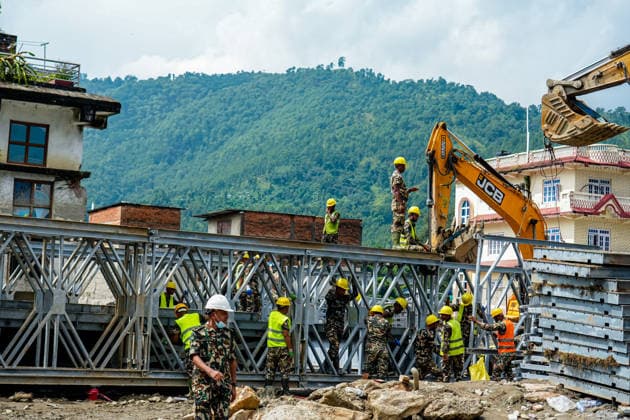 Modular Bridge Construction Starts in Devighat, Nuwakot Kathmandu, Nepal - Septermber 7, 2026: Members of the Nepal Army™s technical engineering team assemble a modular steel bridge over the Tadi River in Devighat, Nuwakot, Nepal. The bridge is being constructed in the aftermath of floods in the Bhotekoshi River that swept away an existing bridge and disrupted road connectivity in Devighat. The new bridge is expected to restore transportation and improve connectivity for local communities in the area. (Photo by AP Tolang Nexpher Images) Nuwakot bagmati