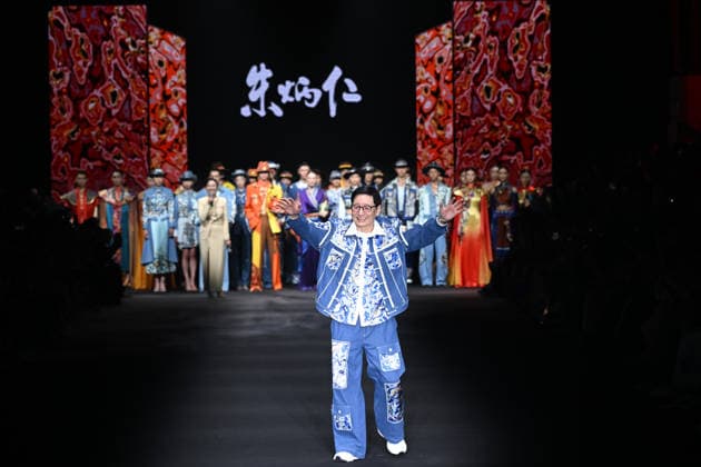 BEIJING, CHINA - SEPTEMBER 10: Zhu Bingren acknowledges the audience after presenting his Jingpai Rongzhuang fashion show during SS2027 Beijing Fashion Week on September 10, 2026 in Beijing, China. The collection features molten copper art and a unique color system designed by Zhu.  Copyright: xChinaxNewsxServicex 111665695975