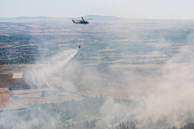 Forest fire in Turkish capital Ankara under control efforts ANKARA, TURKIYE - SEPTEMBER 11: A firefighting helicopter drops water over a forest fire near the Cicek Kent residential complex in the Taspinar neighborhood of Golbasi district in Ankara, Turkiye, on September 11, 2026. Firefighting teams were dispatched to the area to battle the blaze, which broke out for an unknown reason. Following reports of the fire, numerous fire engines, water tenders, tankers and police riot control vehicles were dispatched to the area, while a helicopter was also deployed to battle the blaze from the air. Harun Ozalp Anadolu Ankara Turkey. Editorial use only. Please get in touch for any other usage.  Copyright: x2026xAnadoluxHarunxOzalpx