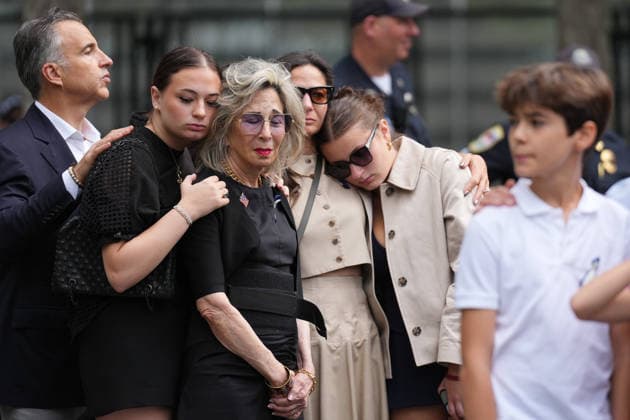 People listen to the National Anthem during a remembrance ceremony marking the 25th anniversary of the 9 11 attacks at the National September 11 Memorial & Museum at Ground Zero in New York on Friday, September 11, 2026. A total of 2,753 people died in the attack on the World Trade Center on September 11, 2001. Pool  WAX20260911937 AdamxGray