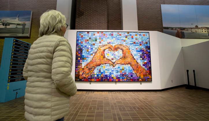 September 11, 2026, Gander, Nl, Canada: Doris MacDougall, a visitor from Vancouver, views the 9 11 Community Mosaic Mural in the foyer of the Gander International Airport in Gander, N.L., on Friday, Sept. 11, 2026. The piece was created from over 600 individually painted tiles commemorating the kindness shown by local residents during the 9 11 attack. Gander Canada - ZUMAc35_ 20260911_zaf_c35_016 Copyright: xPaulxDalyx