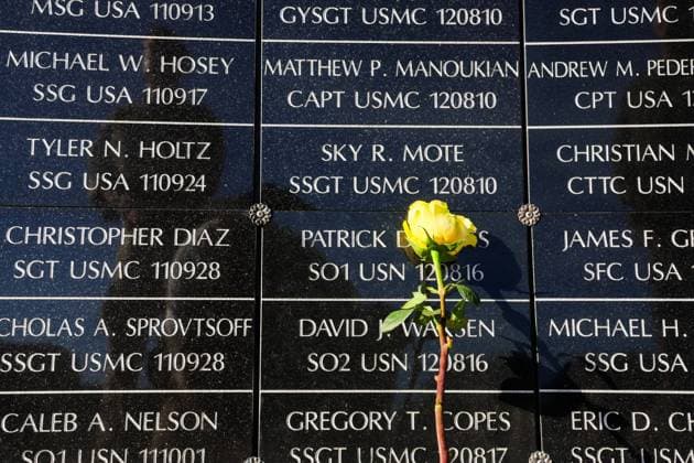 September 11, 2026, Tampa, Florida, USA: A flower rests against the dedicated wall honoring roughly 1,900 fallen special operations service members during the 9 11 25th Anniversary Memorial Service hosted by U.S. Special Operations Command (USSOCOM) to honor the 25th anniversary of the Sept. 11 terrorist attacks at the MacDill AFB Special Operations Forces Memorial on Friday, Sept. 11, 2026 in Tampa. Tampa USA - ZUMAs70_ 20260911_zan_s70_003 Copyright: xDirkxShaddx