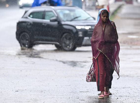 NOIDA, INDIA - SEPTEMBER 11: Commuters pass through a road in Sector 47 during light rain, on September 11, 2026 in Noida, India. (Photo by Sunil Ghosh Hindustan Times ) Heavy Rain Lashes Delhi-NCR