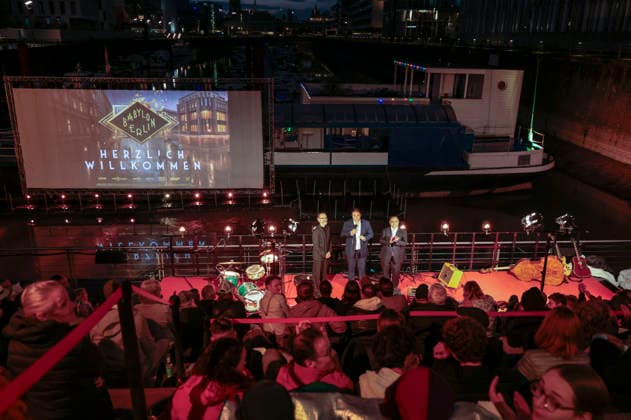 Peter Jordan, Nathanael Liminski und Walid Nakschbandi bei der Premiere der 5. und finalen Staffel der TV-Serie Babylon Berlin im Naturstrom Openair Kino. Köln, 11.09.2026
