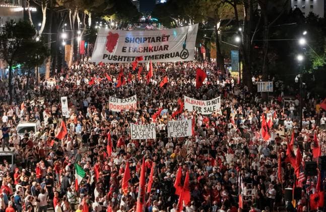 September 13, 2026, Tirane, Albania: TIRANA, ALBANIA Ã¢â‚¬ SEPTEMBER 12, 2026: Albanian citizens, civil society activists, students and members of the Albanian diaspora take part in a protest against a proposed luxury tourism development linked to U.S. investor Jared Kushner. Demonstrators displayed Albanian flags and banners calling for the cancellation of Law 21 2024, which they oppose in connection with the planned project. Tirane Albania - ZUMAq101 20260913_zna_q101_001 Copyright: xVlasovxSulajx