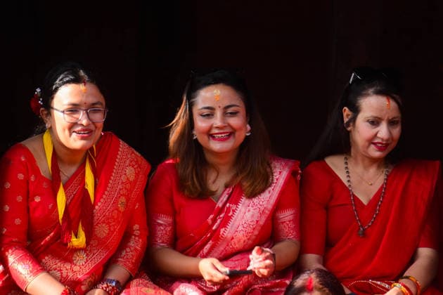 September 14, 2026, Kathmandu, Bagmati, Nepal: Hindu women devotees gather to celebrate the Teej festival at Pashupatinath Temple in Kathmandu, Nepal, on September 14, 2026. Teej, also known as Hartalika Teej, is a major Hindu festival dedicated to Lord Shiva and Goddess Parvati. Women visit the temple from early morning to offer prayers, flowers and puja materials, perform religious rituals and seek blessings. Married women traditionally observe a day-long fast for the health, longevity and well-being of their husbands and the prosperity of their families, while unmarried women may fast and pray for a suitable life partner. Devotees dressed in traditional red saris and festive attire form long queues for darshan and take part in devotional - ZUMAs330 20260914_zsp_s330_018 Copyright: xSafalxPrakashxShresthax