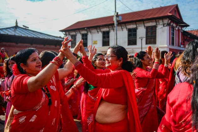 September 14, 2026, Kathmandu, Bagmati, Nepal: Hindu women devotees gather to celebrate the Teej festival at Pashupatinath Temple in Kathmandu, Nepal, on September 14, 2026. Teej, also known as Hartalika Teej, is a major Hindu festival dedicated to Lord Shiva and Goddess Parvati. Women visit the temple from early morning to offer prayers, flowers and puja materials, perform religious rituals and seek blessings. Married women traditionally observe a day-long fast for the health, longevity and well-being of their husbands and the prosperity of their families, while unmarried women may fast and pray for a suitable life partner. Devotees dressed in traditional red saris and festive attire form long queues for darshan and take part in devotional - ZUMAs330 20260914_zsp_s330_023 Copyright: xSafalxPrakashxShresthax