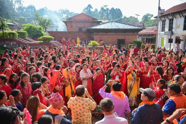 September 14, 2026, Kathmandu, Bagmati, Nepal: Hindu women devotees gather to celebrate the Teej festival at Pashupatinath Temple in Kathmandu, Nepal, on September 14, 2026. Teej, also known as Hartalika Teej, is a major Hindu festival dedicated to Lord Shiva and Goddess Parvati. Women visit the temple from early morning to offer prayers, flowers and puja materials, perform religious rituals and seek blessings. Married women traditionally observe a day-long fast for the health, longevity and well-being of their husbands and the prosperity of their families, while unmarried women may fast and pray for a suitable life partner. Devotees dressed in traditional red saris and festive attire form long queues for darshan and take part in devotional - ZUMAs330 20260914_zsp_s330_026 Copyright: xSafalxPrakashxShresthax