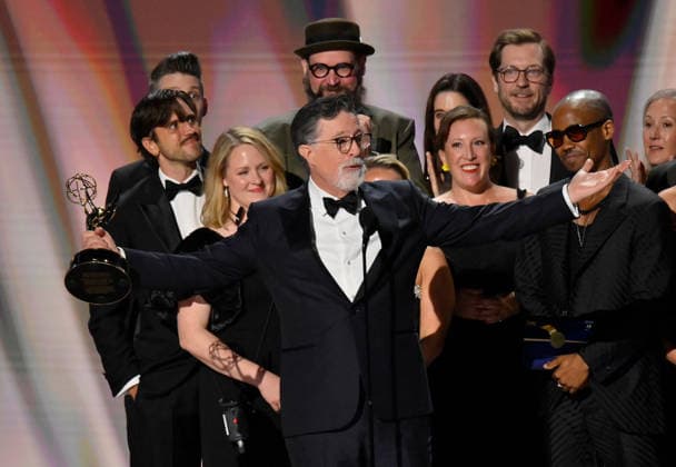 Cast and crew including Ariel Dumas, Opus Moreschi, Lauren Marcello, Sara Vilkomerson, Gabriel W Gronli, Stephen Colbert, Paul Dinello, Bjoern Stejskal, Tanya Michnevich Bracco, Matt Lappin, Michael R Brumm and Aaron Cohen accept the Outstanding Variety Series Award for The Late Show with Stephen Colbert on stage during the 78th annual Primetime Emmy Awards at the Peacock Theater in Los Angeles on Monday, September 14, 2026.  LAP20260914128 JIMxRUYMEN