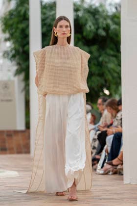 Models present creations from Simorra s FOLD IN collection for spring-summer 2027 during Mercedes-Benz Fashion Week Madrid. The Barcelona-based label, founded in 1978 by Javier Simorra, explores shapes, curves and the fold as a central element in this collection, with garments that adapt to the body and celebrate a beauty that resists rigidity. September 14,2026. (202609141391)