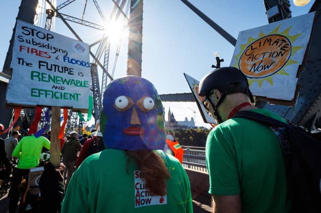 September 19, 2026, Ottawa, On, Canada: Martha Anderson, a member of Seniors for Climate Action Now sports a home made paper mache earth hat during a climate march in Ottawa, on Saturday, Sept. 19, 2026. Ottawa Canada  - ZUMAc35_ 20260919_zaf_c35_010 Copyright: xKeitoxNewmanx