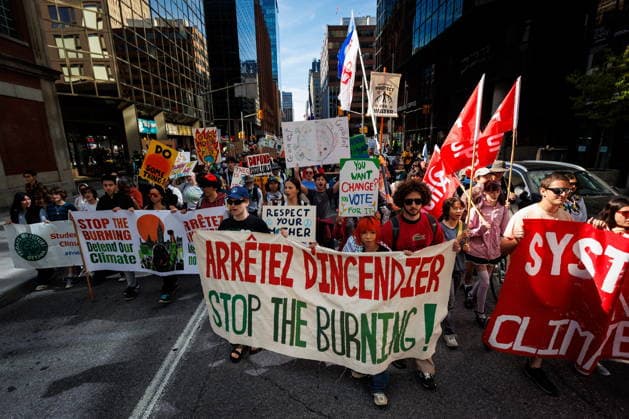 September 19, 2026, Ottawa, On, Canada: People march with signs and banners during a climate march in Ottawa, on Saturday, Sept. 19, 2026. Ottawa Canada  - ZUMAc35_ 20260919_zaf_c35_012 Copyright: xKeitoxNewmanx