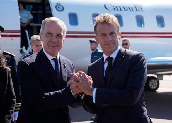 September 20, 2026, Saint-Pierre, France: French President Emmanuel Macron, right, greets Prime Minister Mark Carney as he arrives in Saint-Pierre, Saint-Pierre-et-Miquelon, a French territory 20 kilometres off the southern coast of Newfoundland, on Sunday, Sept. 20, 2026. Saint-Pierre France - ZUMAc35_ 20260920_zaf_c35_066 Copyright: xAdrianxWyldx