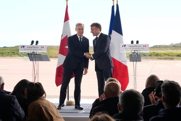September 20, 2026, Saint-Pierre, France: French President Emmanuel Macron, left, and ..Prime Minister Mark Carney shake hands after delivering remarks in Saint-Pierre, Saint-Pierre-et-Miquelon, a French territory 20 kilometres off the southern coast of Newfoundland, on Sunday, Sept.20, 2026. Saint-Pierre France - ZUMAc35_ 20260920_zaf_c35_069 Copyright: xAdrianxWyldx