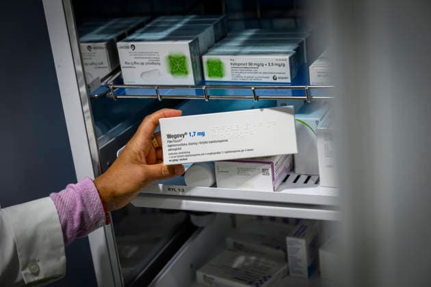 Medications at Apoteket Hjärtat Lindhagen: Pharmacy staff are retrieving a refrigerated injectable medication from the pharmacy’s  Copyright: xMattiasxdexFrumeriex Läkemedel Apotek
