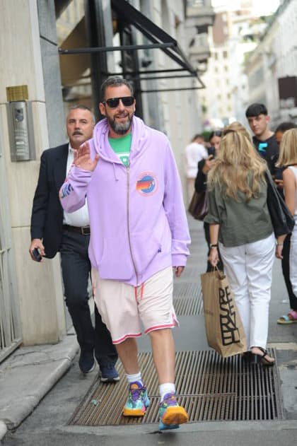 RECORD DATE NOT STATED IPA88808756 - Milan, photo by Mimmo Carriero—After stopping by Bacaro, a restaurant on Via Montenapoleone, Adam Sandler strolls through the streets of downtown. He is recognized immediately, and people ask him for photos and autographs, which he grants without hesitation. His wife Jackie follows him at a distance so as not to be recognized or photographed, and after entering the hotel—thinking no one is watching—they let themselves go, kissing and embracing before heading up to their room.  Copyright: xx xx IPA88808756