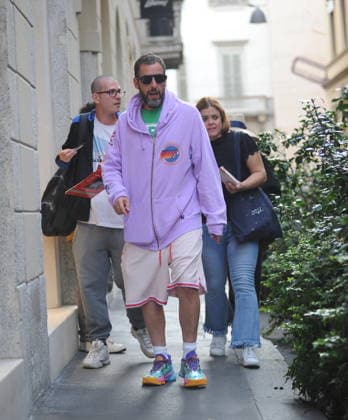 RECORD DATE NOT STATED IPA88808781 - Milan, photo by Mimmo Carriero—After stopping by Bacaro, a restaurant on Via Montenapoleone, Adam Sandler strolls through the streets of downtown. He is recognized immediately, and people ask him for photos and autographs, which he grants without hesitation. His wife Jackie follows him at a distance so as not to be recognized or photographed, and after entering the hotel—thinking no one is watching—they let themselves go, kissing and embracing before heading up to their room.  Copyright: xx xx IPA88808781