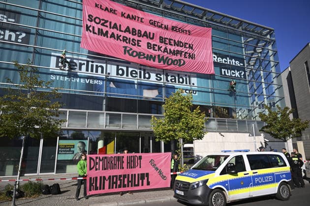 Environmental activists protest at CDU headquarters in Berlin BERLIN, GERMANY - SEPTEMBER 23: Environmental activists stage a protest at the Christian Democratic Union (CDU) headquarters, displaying banners on the building facade, in Berlin, Germany, on September 23, 2026. ROBIN WOOD activists climbed the CDU headquarters and unfurled the banner, criticizing the CDU-led federal government over what they described as insufficient action on climate protection and a lack of measures to counter the rise of the far-right Alternative for Germany (AfD). Halil Sagirkaya Anadolu Berlin Germany. Editorial use only. Please get in touch for any other usage.  Copyright: x2026xAnadoluxHalilxSagirkayax