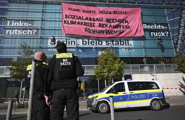Environmental activists protest at CDU headquarters in Berlin BERLIN, GERMANY - SEPTEMBER 23: Environmental activists stage a protest at the Christian Democratic Union (CDU) headquarters, displaying banners on the building facade, in Berlin, Germany, on September 23, 2026. ROBIN WOOD activists climbed the CDU headquarters and unfurled the banner, criticizing the CDU-led federal government over what they described as insufficient action on climate protection and a lack of measures to counter the rise of the far-right Alternative for Germany (AfD). Halil Sagirkaya Anadolu Berlin Germany. Editorial use only. Please get in touch for any other usage.  Copyright: x2026xAnadoluxHalilxSagirkayax