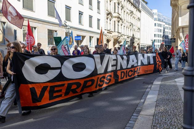 September 26, 2026, Leipzig, Saxony, Germany: Demonstrators participate in an UnkoÂ¼rzbar rally in Leipzig, Germany, on September 26, 2026, protesting cuts to social services and criticizing government spending priorities. Among the signs displayed during the demonstration were messages opposing increased investment in the arms industry and criticizing the Covenant military technology project in Leipzig. Protesters carried banners and placards calling for greater investment in social services and addressing issues including public spending, employment, pensions, healthcare and military expenditure. The demonstration took place in central Leipzig as part of the wider UnkoÂ¼rzbar campaign against cuts to social services. Leipzig Germany - ZUMAc291 20260926_zip_c291_010 Copyright: xMariaxCastrox