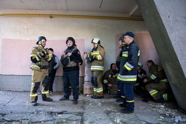 September 26, 2026, Kyiv, Ukraine: KYIV, UKRAINE, SEPTEMBER 26, 2026: Firefighters work at a five-story residential building damaged during a Russian drone attack in KyivÃ¢â‚¬â ¢s Solomianskyi district, as residents watch emergency operations and clear shattered glass from the area. Kyiv authorities said a fire broke out at the residential building and a ground-floor shop following the fall of a drone, injuring four people and prompting rescuers to evacuate 20 residents. Kyiv Ukraine  - ZUMAq101 20260926_zna_q101_101 Copyright: xNastassiaxKantorowiczxTorresx