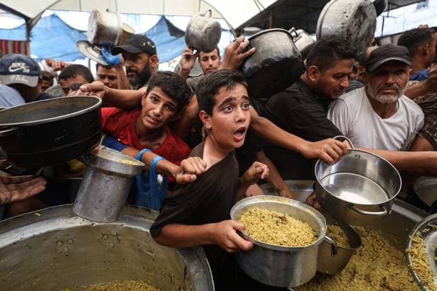 Hot meal distribution in Gaza GAZA CITY, GAZA, PALESTINE - SEPTEMBER 28: Palestinians, including children carrying cooking pots, gather to receive hot meals distributed in the Nuseirat Refugee Camp in Gaza City, Gaza, Palestine on September 28, 2026. The ongoing Israeli attacks despite the ceasefire have exacerbated severe food shortages across the region. Hassan Jedi Anadolu Gaza City Gaza. Editorial use only. Please get in touch for any other usage.  Copyright: x2026xAnadoluxHassanxJedix