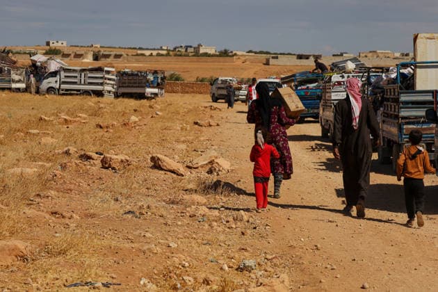 65 families return to their homes from Rasm al-Akhdar camp in Manbij MANBIJ, SYRIA - SEPTEMBER 28: A total of 65 families, comprising around 300 people living at Rasm al-Akhdar camp in the Manbij area of northern Syria leave the camp to return to their homes in Aleppo and Raqqa, on September 28, 2026. The convoy of families set off for the areas of Maskanah and Deir Hafir in Aleppo province and locations in Raqqa. The Syrian Red Crescent distributed emergency aid packages to the families leaving the camp. Nebieha Altaha Anadolu Manbij Syria. Editorial use only. Please get in touch for any other usage.  Copyright: x2026xAnadoluxNebiehaxAltahax