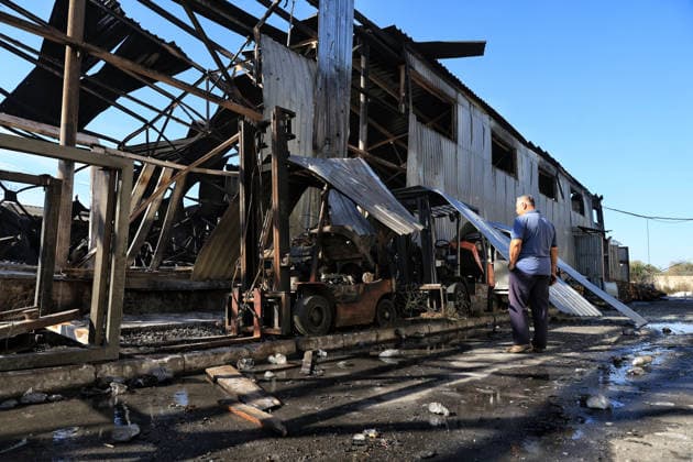 A worker looks at equipment and a shop at a civilian industrial facility producing plastic tableware, damaged by a nighttime Russian drone strike in the Odesa region, Ukraine, September 29, 2026. (Photo by Nina Liashonok Ukrinform) Manufacturing plant burns down in Odesa region due to Russian drone attack  Copyright: xNinaxLiashonokx