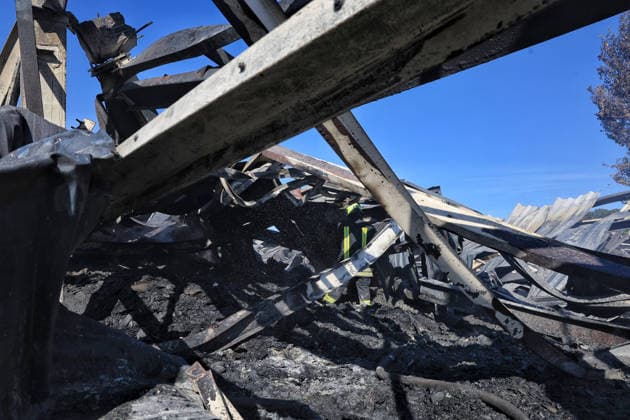 A rescuer works at a civilian industrial facility producing plastic tableware, damaged by a fire caused by a nighttime Russian drone strike in the Odesa region, Ukraine, September 29, 2026. (Photo by Nina Liashonok Ukrinform) Manufacturing plant burns down in Odesa region due to Russian drone attack  Copyright: xNinaxLiashonokx