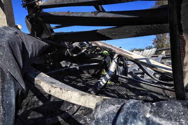 A rescuer works at a civilian industrial facility producing plastic tableware, damaged by a fire caused by a nighttime Russian drone strike in the Odesa region, Ukraine, September 29, 2026. (Photo by Nina Liashonok Ukrinform) Manufacturing plant burns down in Odesa region due to Russian drone attack  Copyright: xNinaxLiashonokx