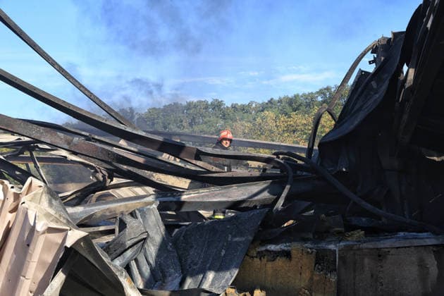 A rescuer works at a civilian industrial facility producing plastic tableware, damaged by a fire caused by a nighttime Russian drone strike in the Odesa region, Ukraine, September 29, 2026. (Photo by Nina Liashonok Ukrinform) Manufacturing plant burns down in Odesa region due to Russian drone attack  Copyright: xNinaxLiashonokx