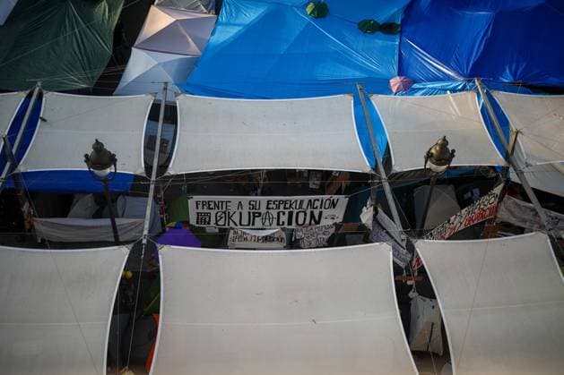 September 29, 2026, Madrid, Spain: A sign bearing the slogan Against their speculation, occupation is visible among tents in Madrid...Fourth day of the encampment at Madrid s Puerta del Sol. Hundreds of tents remain set up by housing activists who organized the occupation of the square in response to the eviction of MaricarmenÃ¢â‚¬a woman in her eightiesÃ¢â‚¬from her home by a vulture fund..Fourth day of the encampment at Madrid s Puerta del Sol. Hundreds of tents remain set up by housing activists who organized the occupation of the square in response to the eviction of MaricarmenÃ¢â‚¬a woman in her eightiesÃ¢â‚¬from her home by a vulture fund. Madrid Spain - ZUMAs197 20260929_aaa_s197_299 Copyright: xDavidxCanalesx