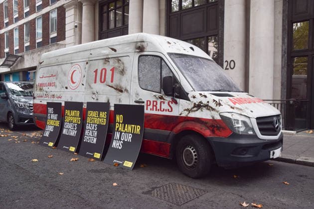 September 30, 2026, London, England, United Kingdom: A van made to look like a heavily damaged Gaza ambulance is parked outside Palantir headquarters in Soho Square as Amnesty International UK and Just Treatment stage a protest calling on the UK Government not to extend its NHS contract with the US tech company. London United Kingdom - ZUMAv130 20260930_zip_v130_015 Copyright: xVukxValcicx