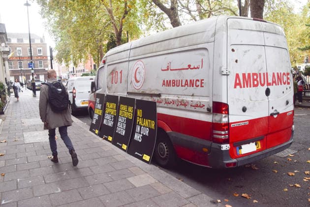 September 30, 2026, London, England, United Kingdom: A van made to look like a heavily damaged Gaza ambulance is parked outside Palantir headquarters in Soho Square as Amnesty International UK and Just Treatment stage a protest calling on the UK Government not to extend its NHS contract with the US tech company. London United Kingdom - ZUMAv130 20260930_zip_v130_017 Copyright: xVukxValcicx