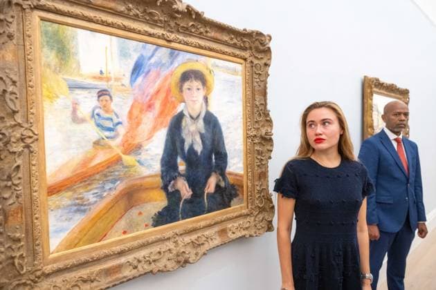 September 30, 2026, London, England, United Kingdom: Pierre-Auguste Renoir En Canot (Jeune fille a la barque), estimated at around USD 25-30 million, is seen with a staff member during a media preview of the Blaquier-Arrieta Collection at Sotheby s in London, Britain, September 30, 2026. The collection of 12 largely unseen Impressionist and Modern works will be offered at auction in New York in November. London United Kingdom - ZUMAk172 20260930_zip_k172_013 Copyright: xThomasxKrychx