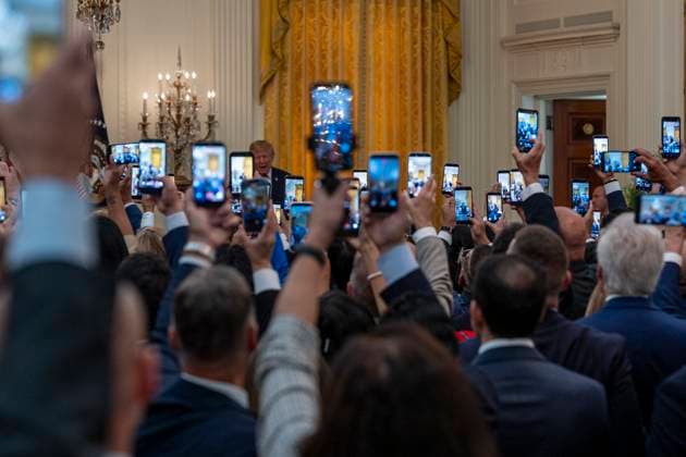 September 30, 2026, Washington, District of Columbia, USA: Attendees hold up thier phones as President Trump speaks at a Hispanic Heritage Month Celebration in the East Room of the White House. During the event, Trump spoke about his White House renovations, foreign policy, and the upcoming November elections. Washington USA  - ZUMAs197 20260930_aaa_s197_152 Copyright: xJenxGolbeckx