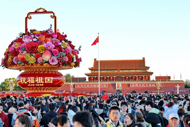 BEIJING, CHINA - OCTOBER 01: People gather to witness the national flag raising ceremony at Tiananmen Square on October 1, 2026 in Beijing, China. The event marks the 77th anniversary of the founding of the People s Republic of China.  Copyright: xVCGx 111670880107